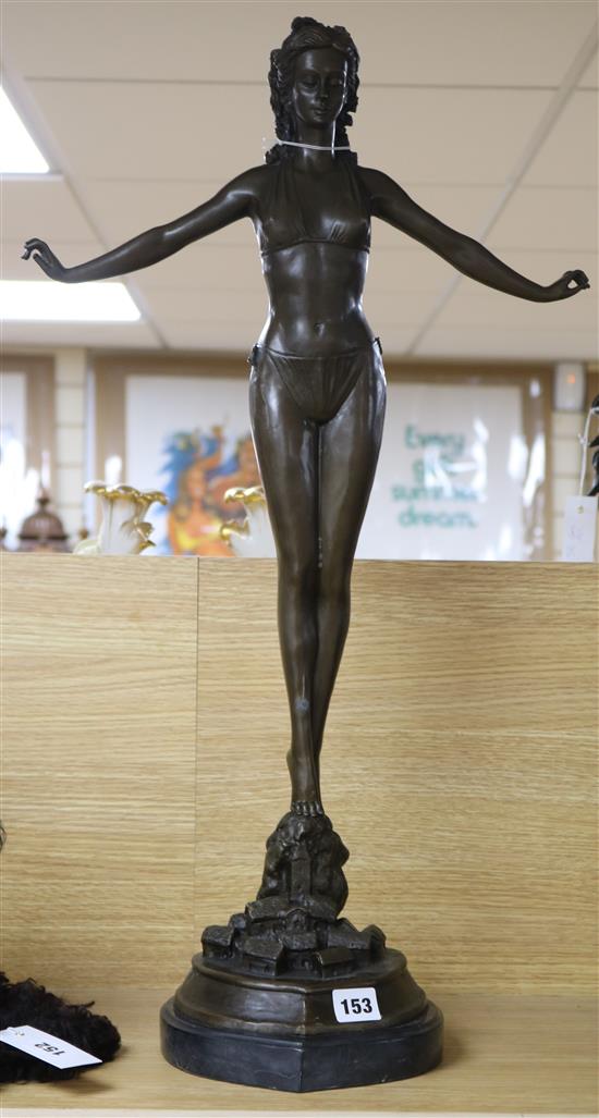 After Jules Jouane. A tall bronze figure of a girl in a bikini, height 71cm